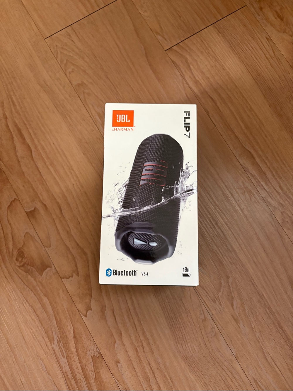 JBL Flip 7 Portable Speaker - Black with Orange Logo Accents